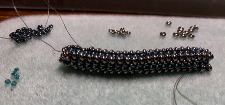 July 21 - My latest project. Jo says it looks like a beaded caterpillar. Size 11 and 15 demi beads. Tiny! July 21 - My latest project. Jo says it looks like a beaded caterpillar. Size 11 and 15 demi beads. Tiny!